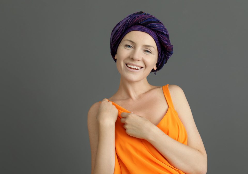 Woman After Chemotherapy On Grey Background