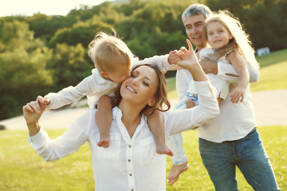 Family In Nature Parents With Children Have Fun Playing 