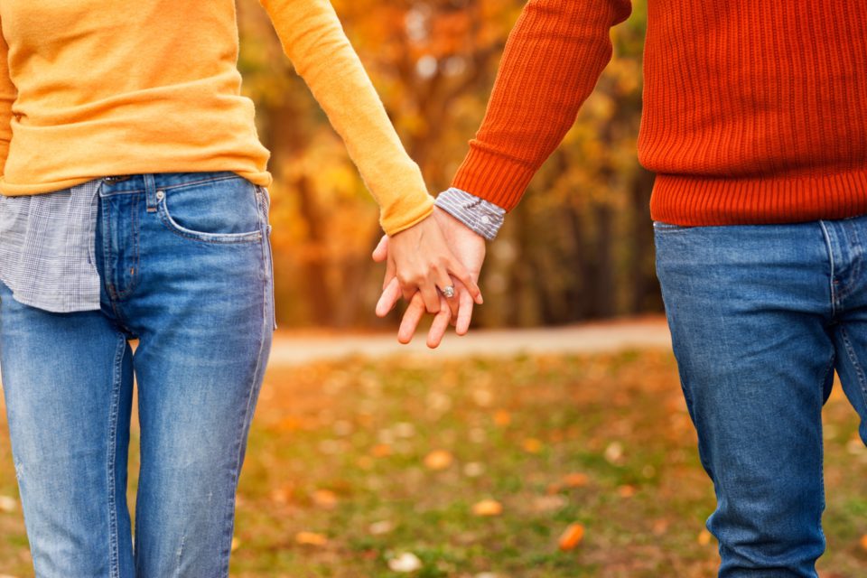 Couple In Love Walking In The Autumn Park